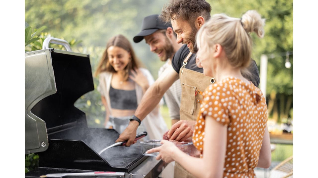 A sizzling steak being grilled on a barbecue, surrounded by fresh herbs and spices, illustrating cooking tips for steak preparation.