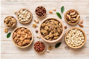 A portion of nuts measured out in a bowl, demonstrating portion control to avoid overeating on a Banting diet.